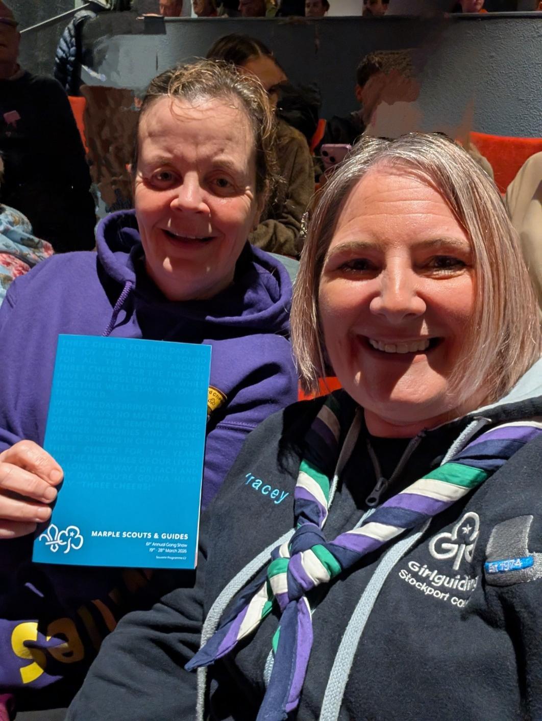 Image shows Tracey and a volunteer at a Gang Show